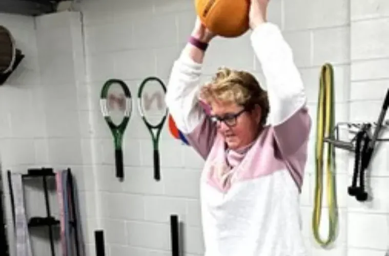 Happy woman in exercise class