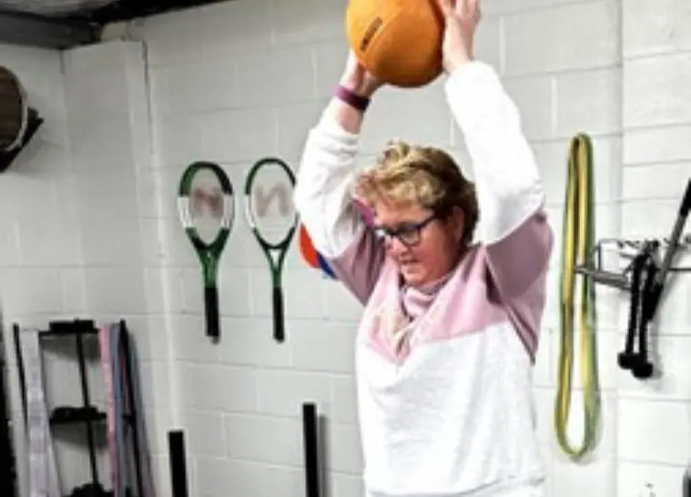 Happy woman in exercise class